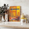Illustration of San Francisco skyline with warm brown and orange tones - styled on a counter with eucalyptus and a bowl of lemons