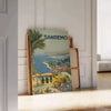 Travel poster depicting Sanremo, Italy, in soft gray and green tones - leaning on a herringbone floor against a white panelled wall