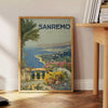 Travel poster depicting Sanremo, Italy, in soft gray and green tones - beside a round wooden side table with books