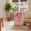 Rustic kitchen scene featuring sardines in brown and gray tones - in a Parisian living room with a sofa and a fig plant