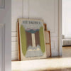A vintage travel poster featuring the text 'See America' with green and gray landscapes. - leaning on a herringbone floor against a white panelled wall