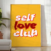 Abstract design featuring the phrase 'Self Love Club' in bold typography with warm orange and red tones - in a bright minimalist room with a plant and an armchair