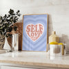 Abstract design with brown and blue hues promoting self-love and positivity - styled on a counter with eucalyptus and a bowl of lemons