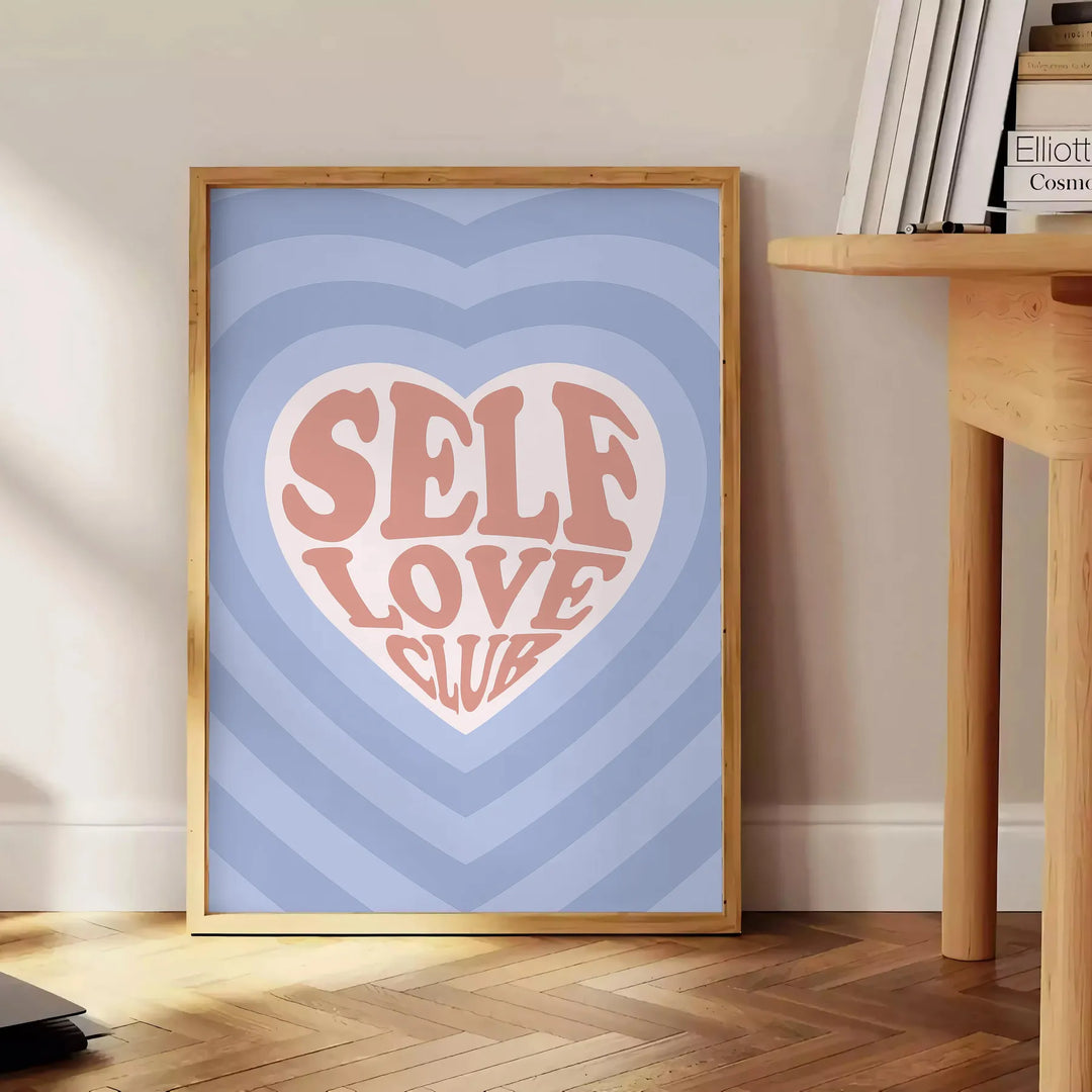 Abstract design with brown and blue hues promoting self-love and positivity - beside a round wooden side table with books