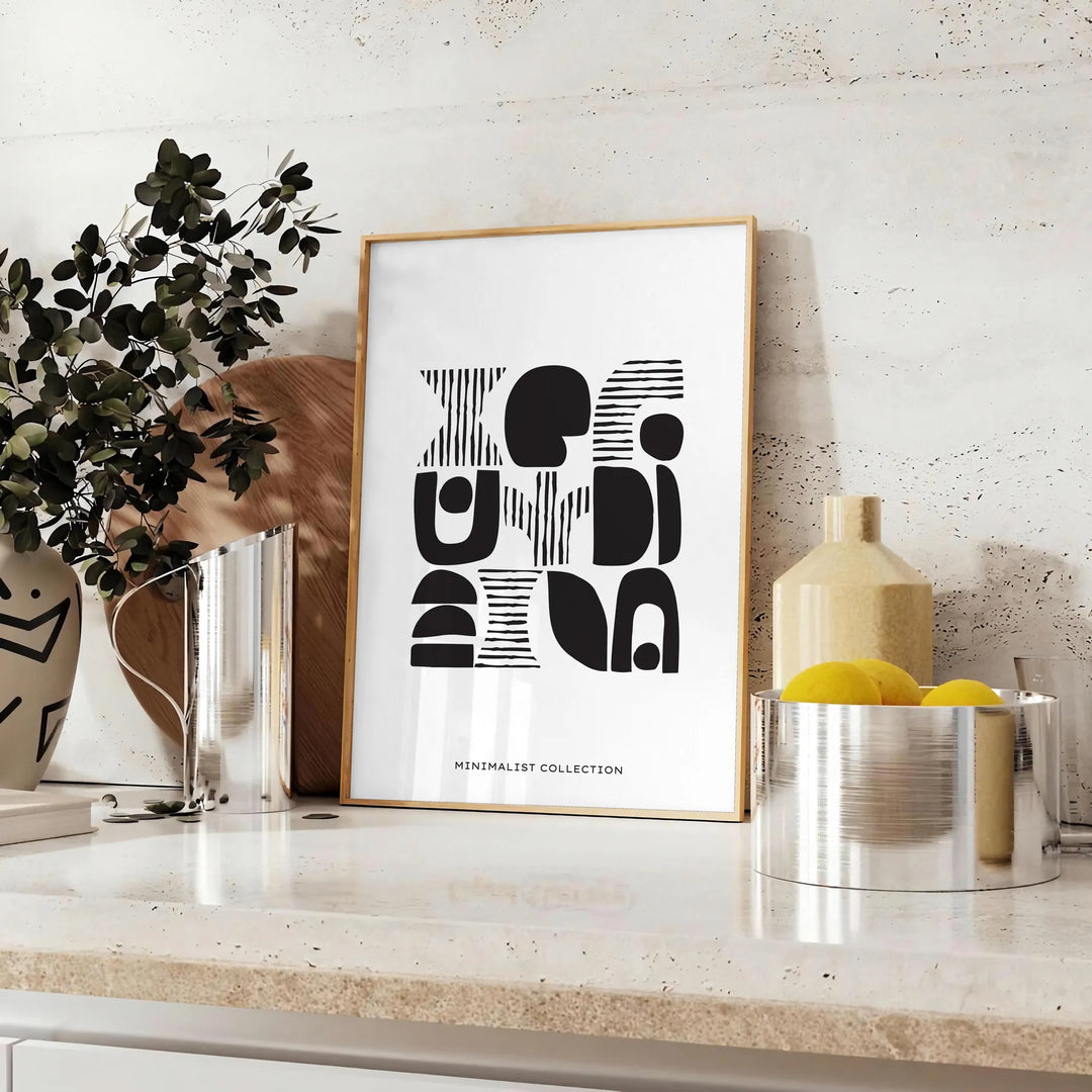 Abstract shapes in a bohemian style with gray and black tones - styled on a counter with eucalyptus and a bowl of lemons