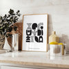 Abstract shapes in a bohemian style with gray and black tones - styled on a counter with eucalyptus and a bowl of lemons
