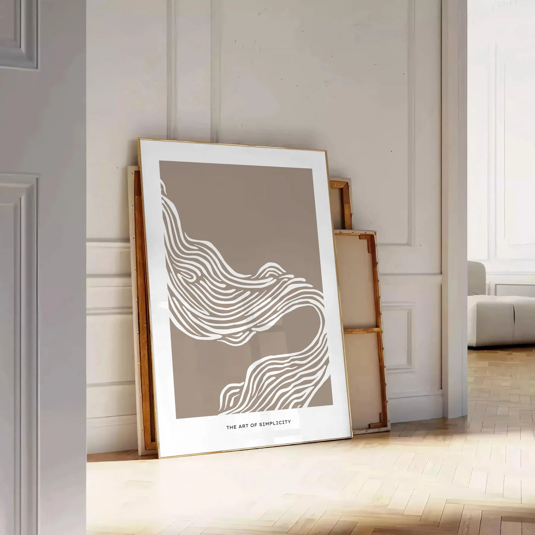 Abstract boho art featuring unique shapes in earthy tones - leaning on a herringbone floor against a white panelled wall