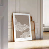Abstract boho art featuring unique shapes in earthy tones - leaning on a herringbone floor against a white panelled wall