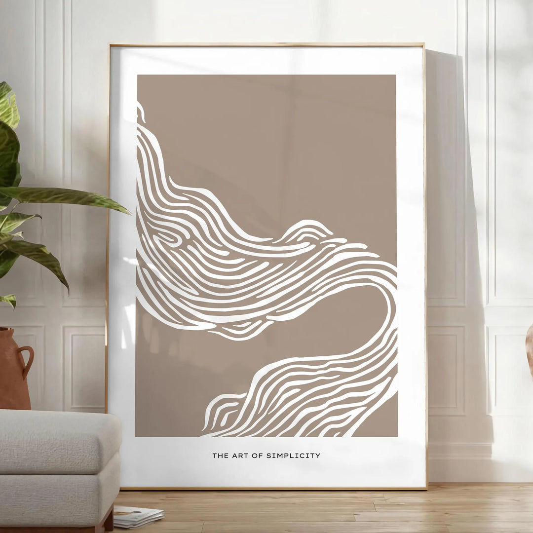 Abstract boho art featuring unique shapes in earthy tones - in a bright minimalist room with a plant and an armchair