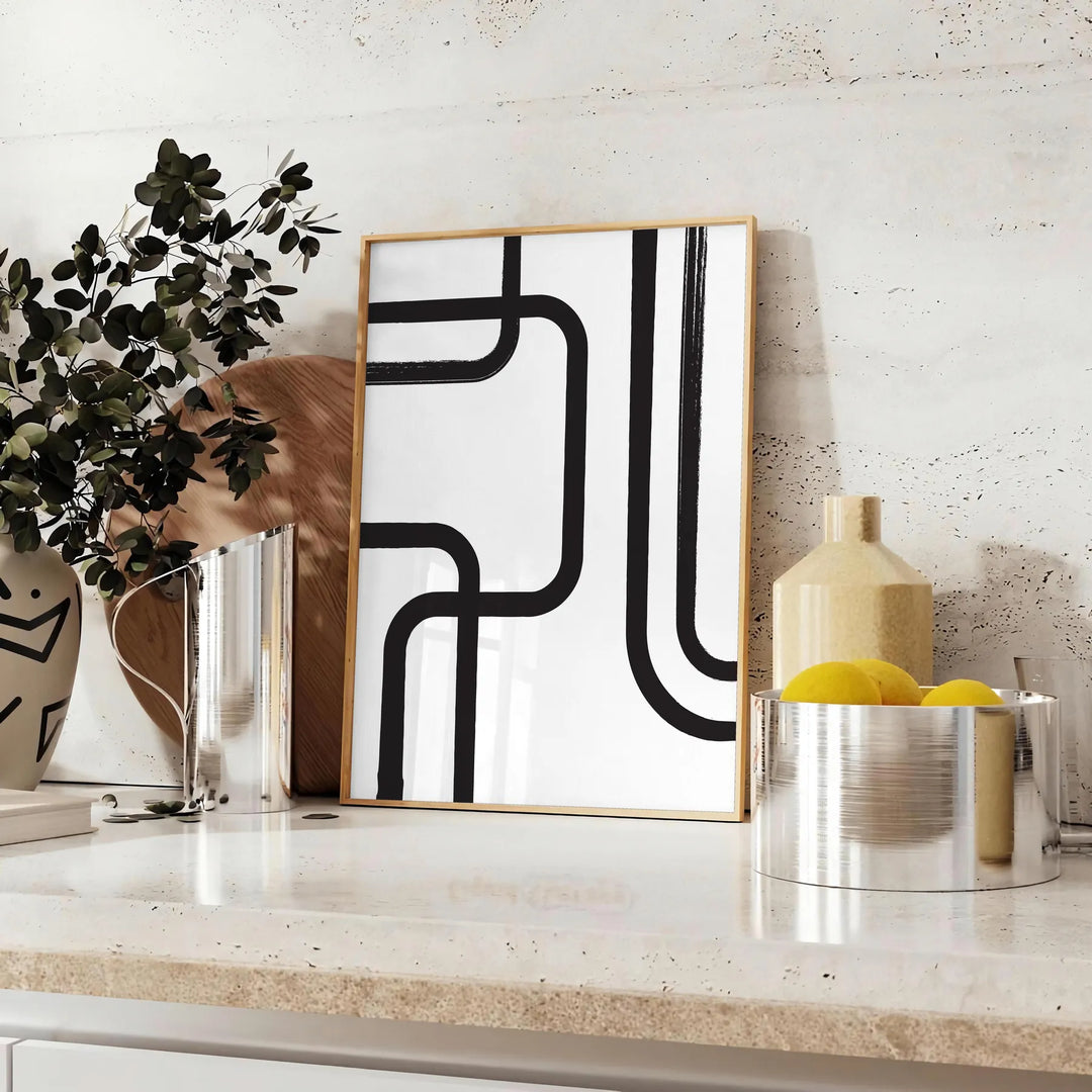 Abstract shapes in black and blue with a boho style - styled on a counter with eucalyptus and a bowl of lemons