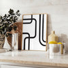 Abstract shapes in black and blue with a boho style - styled on a counter with eucalyptus and a bowl of lemons