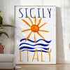 Vintage poster featuring Sicily, Italy with blue and orange hues - in a bright minimalist room with a plant and an armchair