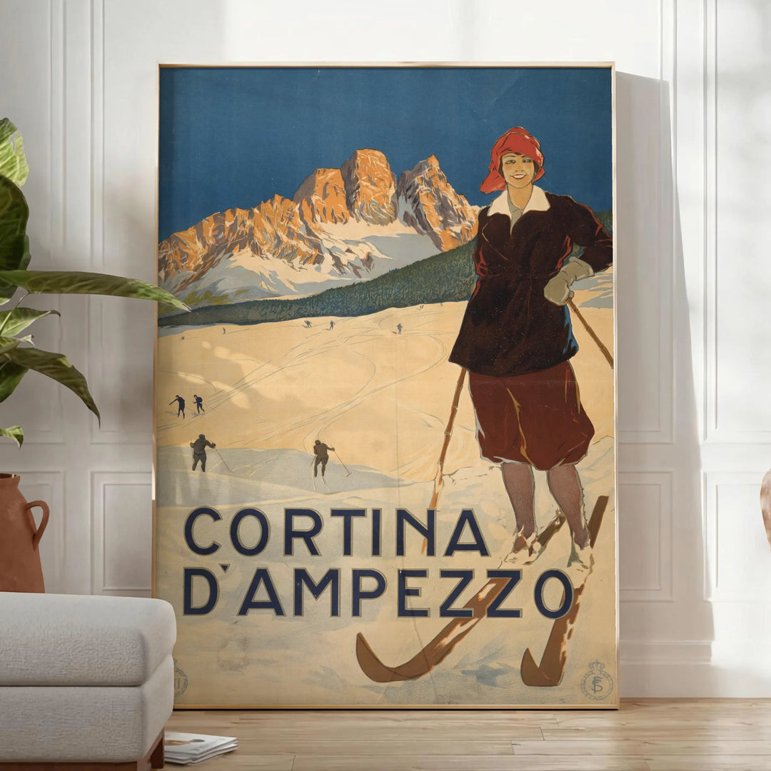 A ski scene with snow-covered mountains and pine trees in green and blue tones - in a bright minimalist room with a plant and an armchair