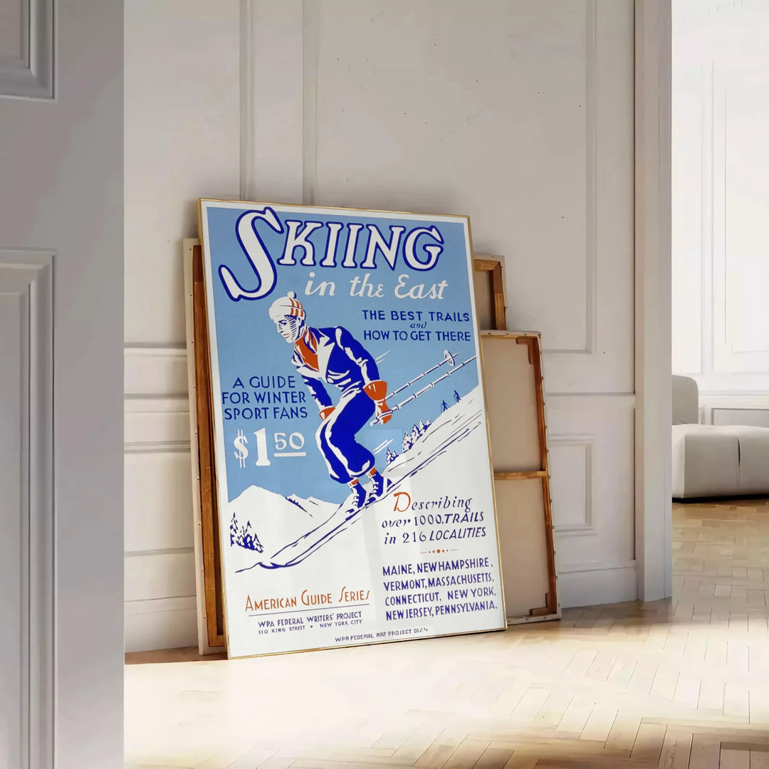 A ski scene with snowy slopes and blue skies - leaning on a herringbone floor against a white panelled wall