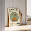 A poster featuring a plate of spaghetti with rich tomato sauce and herbs - leaning on a herringbone floor against a white panelled wall