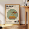 A poster featuring a plate of spaghetti with rich tomato sauce and herbs - beside a round wooden side table with books
