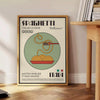 A black background featuring a bowl of spaghetti with green basil and red tomatoes - beside a round wooden side table with books