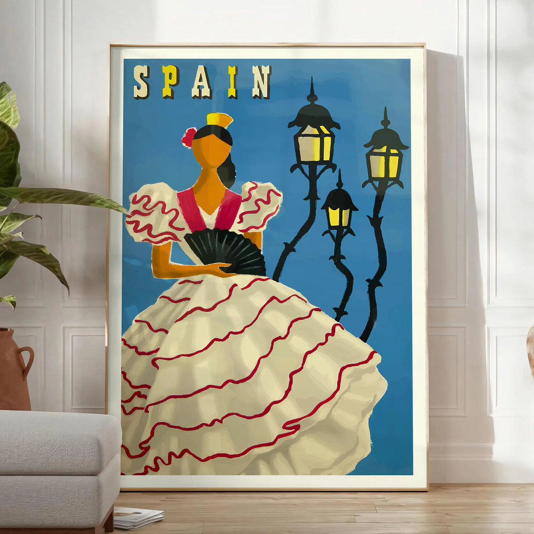 Vintage travel poster featuring Spain with rustic blue and brown tones - in a bright minimalist room with a plant and an armchair