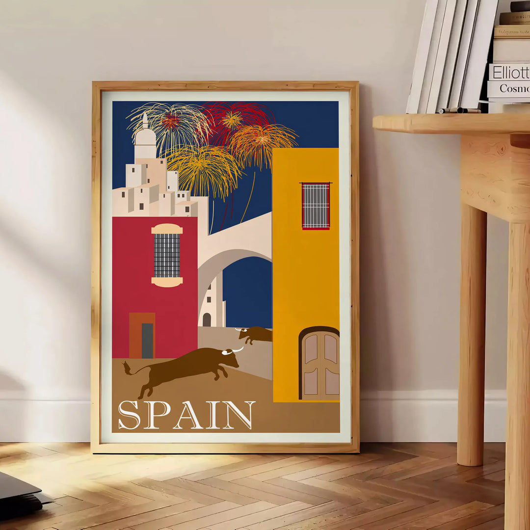 Vintage travel poster featuring Spain with blue and orange tones - beside a round wooden side table with books