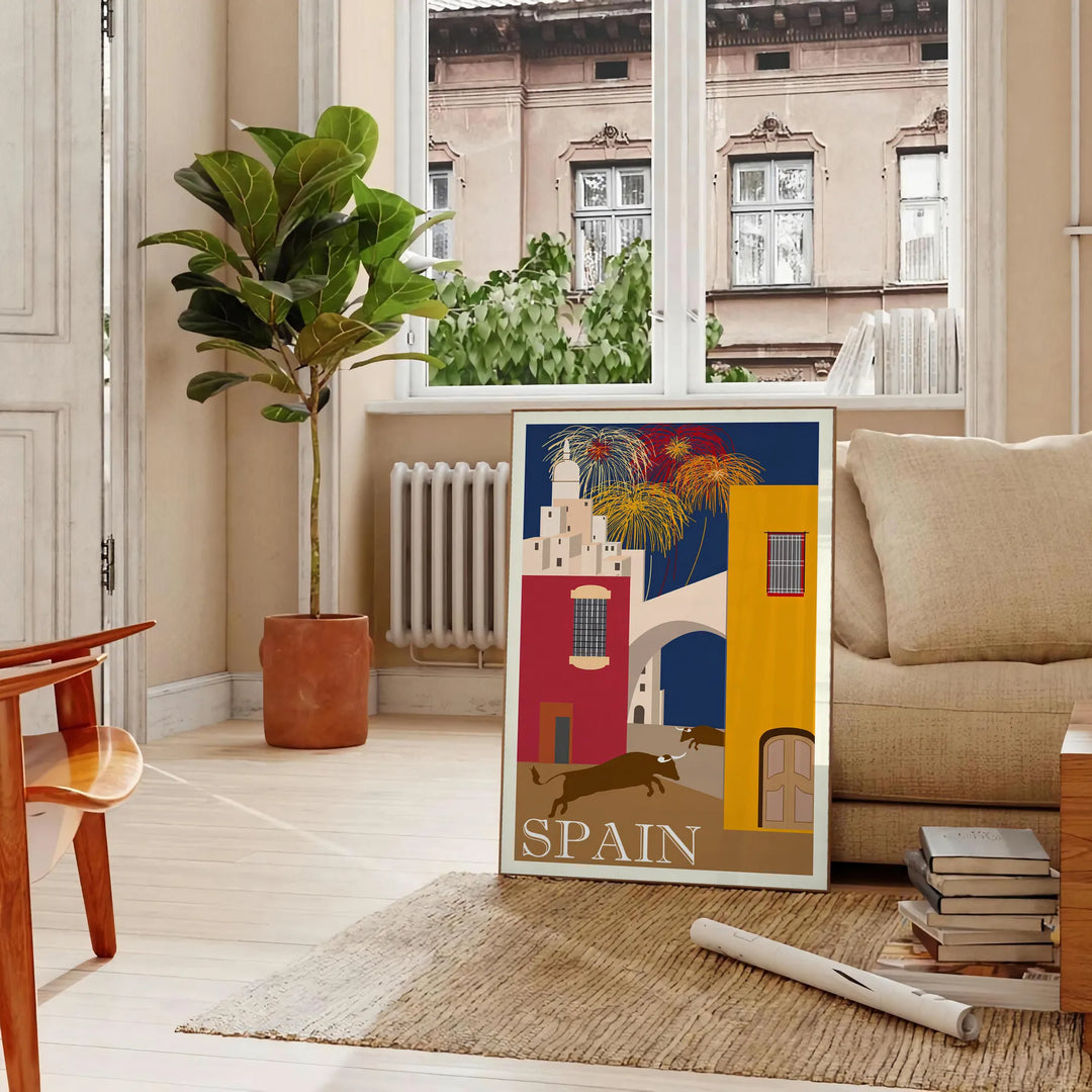 Vintage travel poster featuring Spain with blue and orange tones - in a Parisian living room with a sofa and a fig plant