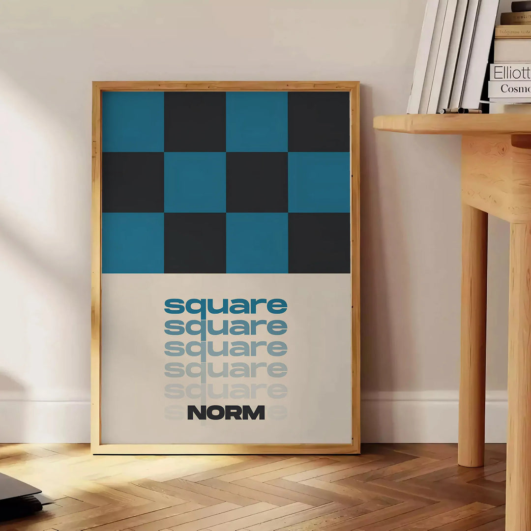 Abstract square shapes in black and brown tones - beside a round wooden side table with books