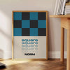 Abstract square shapes in black and brown tones - beside a round wooden side table with books