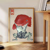 Japanese print featuring a serene landscape with warm brown and orange tones - beside a round wooden side table with books