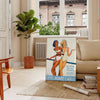 Vintage travel poster featuring Monte Carlo in orange and white hues - in a Parisian living room with a sofa and a fig plant