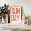 Abstract design with warm brown and red hues featuring motivational text - styled on a counter with eucalyptus and a bowl of lemons