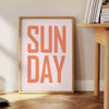 Abstract design with warm brown and red hues featuring motivational text - beside a round wooden side table with books