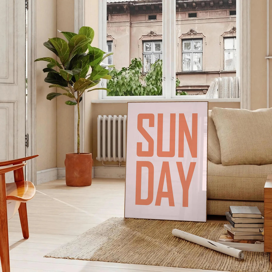 Abstract design with warm brown and red hues featuring motivational text - in a Parisian living room with a sofa and a fig plant