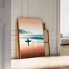 Dynamic waves in orange and green, capturing surf energy - leaning on a herringbone floor against a white panelled wall