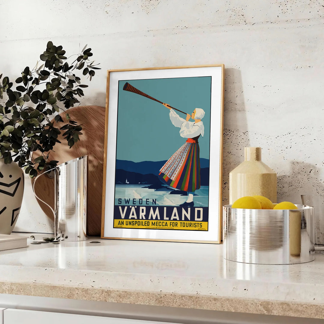 A scenic view of Värmland, Sweden with lush green landscapes and gray skies - styled on a counter with eucalyptus and a bowl of lemons