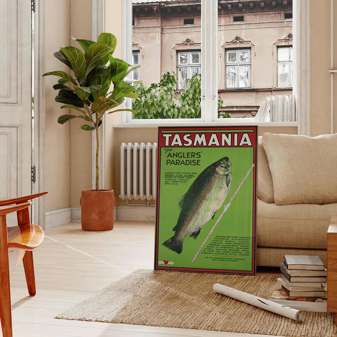 Illustration of Tasmania's landscapes with green hills and gray skies - in a Parisian living room with a sofa and a fig plant