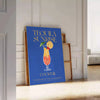 A colorful illustration of a Tequila Sunrise cocktail with orange and yellow hues. - leaning on a herringbone floor against a white panelled wall