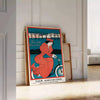 Travel poster featuring New York skyline with green and blue tones - leaning on a herringbone floor against a white panelled wall