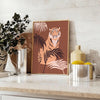 A stylized tiger in gray and green tones, showcasing its fierce expression. - styled on a counter with eucalyptus and a bowl of lemons