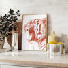 A fierce tiger prowling through a lush green jungle, with orange and red hues. - styled on a counter with eucalyptus and a bowl of lemons