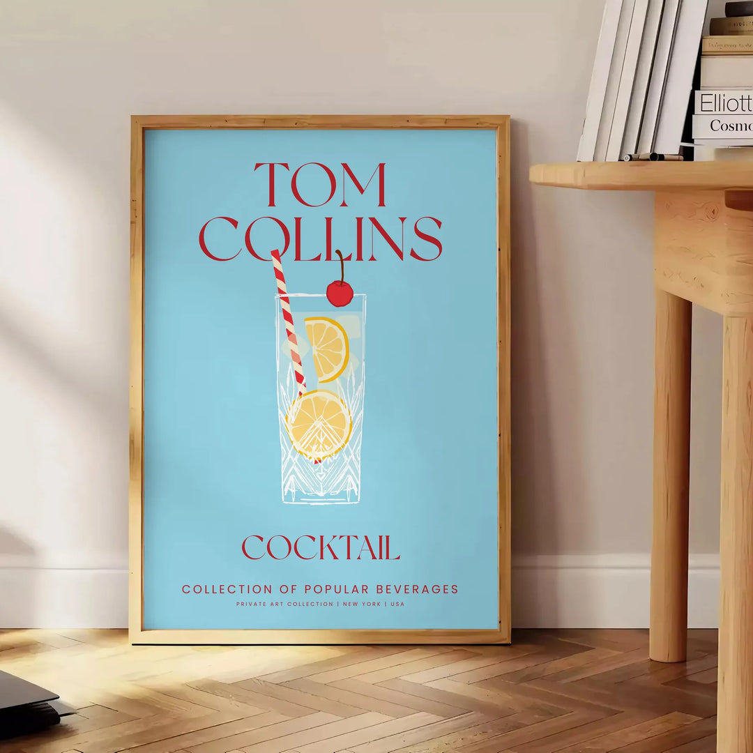 Illustration of a Tom Collins cocktail in a glass with lemon and cherry, yellow and blue colors - beside a round wooden side table with books