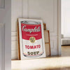 A colorful depiction of a tomato soup can with a vintage pub aesthetic - leaning on a herringbone floor against a white panelled wall