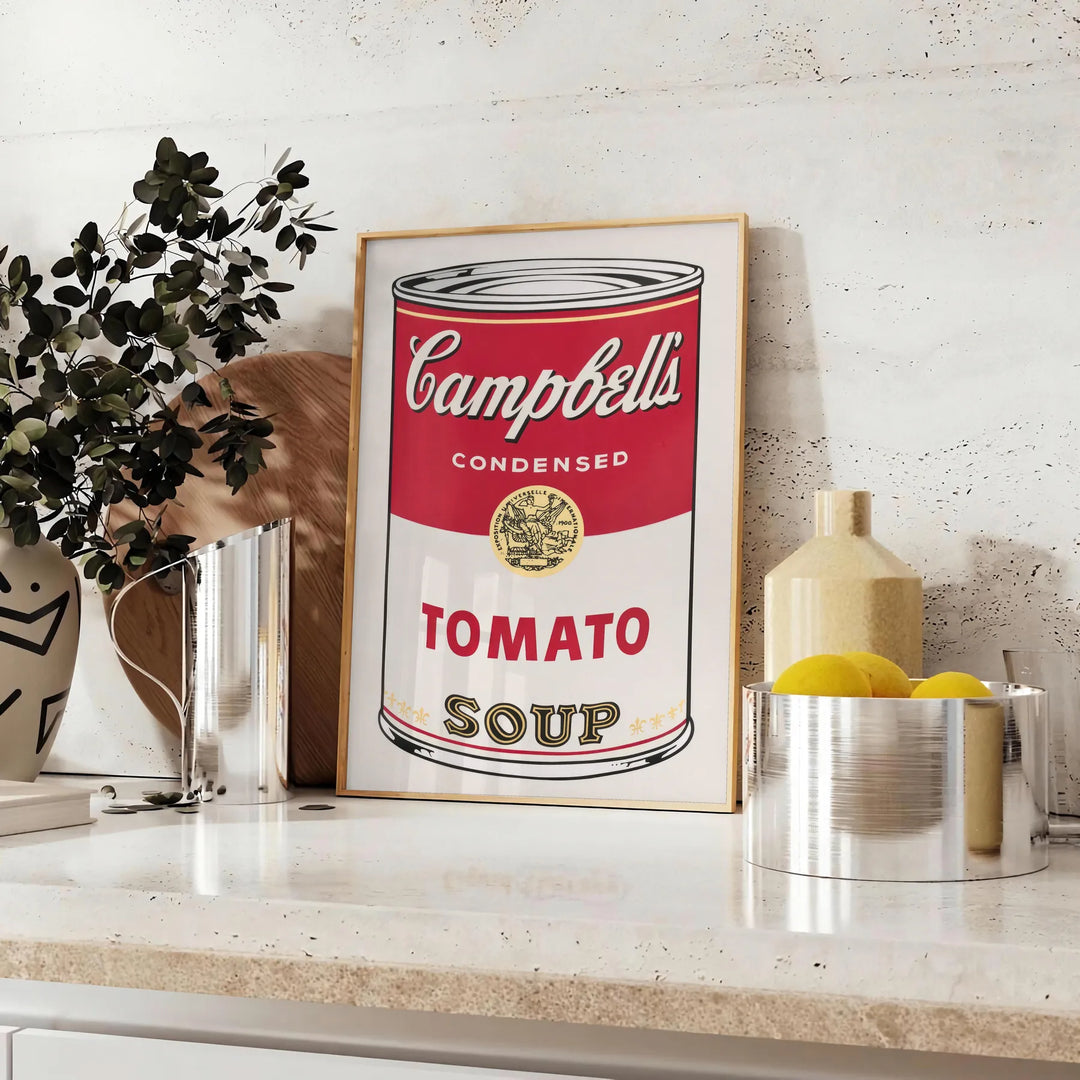 A colorful depiction of a tomato soup can with a vintage pub aesthetic - styled on a counter with eucalyptus and a bowl of lemons