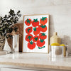 a colorful illustration of tomatoes on a blue background - styled on a counter with eucalyptus and a bowl of lemons