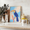 A colorful toucan perched on a branch with bright orange and blue feathers - styled on a counter with eucalyptus and a bowl of lemons