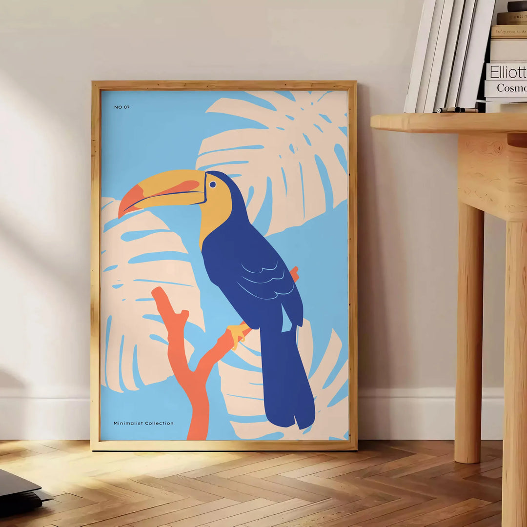 A colorful toucan perched on a branch with bright orange and blue feathers - beside a round wooden side table with books