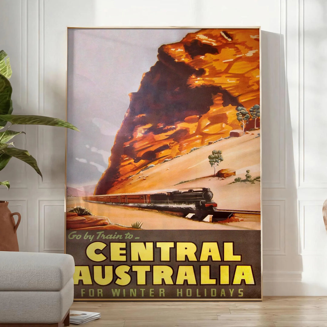 Illustration of a train traveling through lush Australian landscapes in green and blue tones - in a bright minimalist room with a plant and an armchair