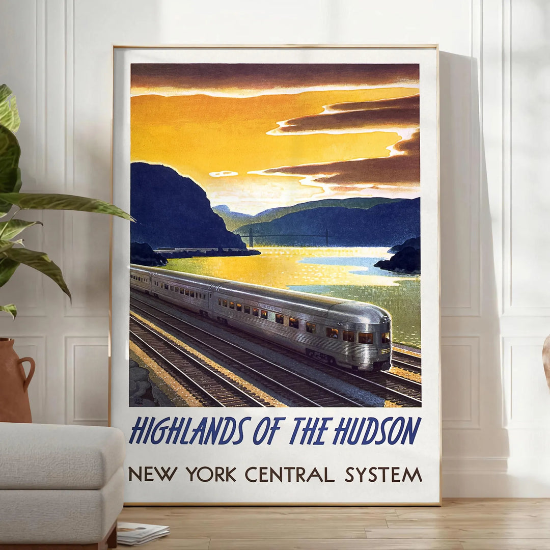 A vintage-style train travel poster featuring a gray and blue color palette - in a bright minimalist room with a plant and an armchair