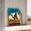 A vintage travel poster featuring a stylized landscape of Australia in black and blue tones - leaning on a herringbone floor against a white panelled wall