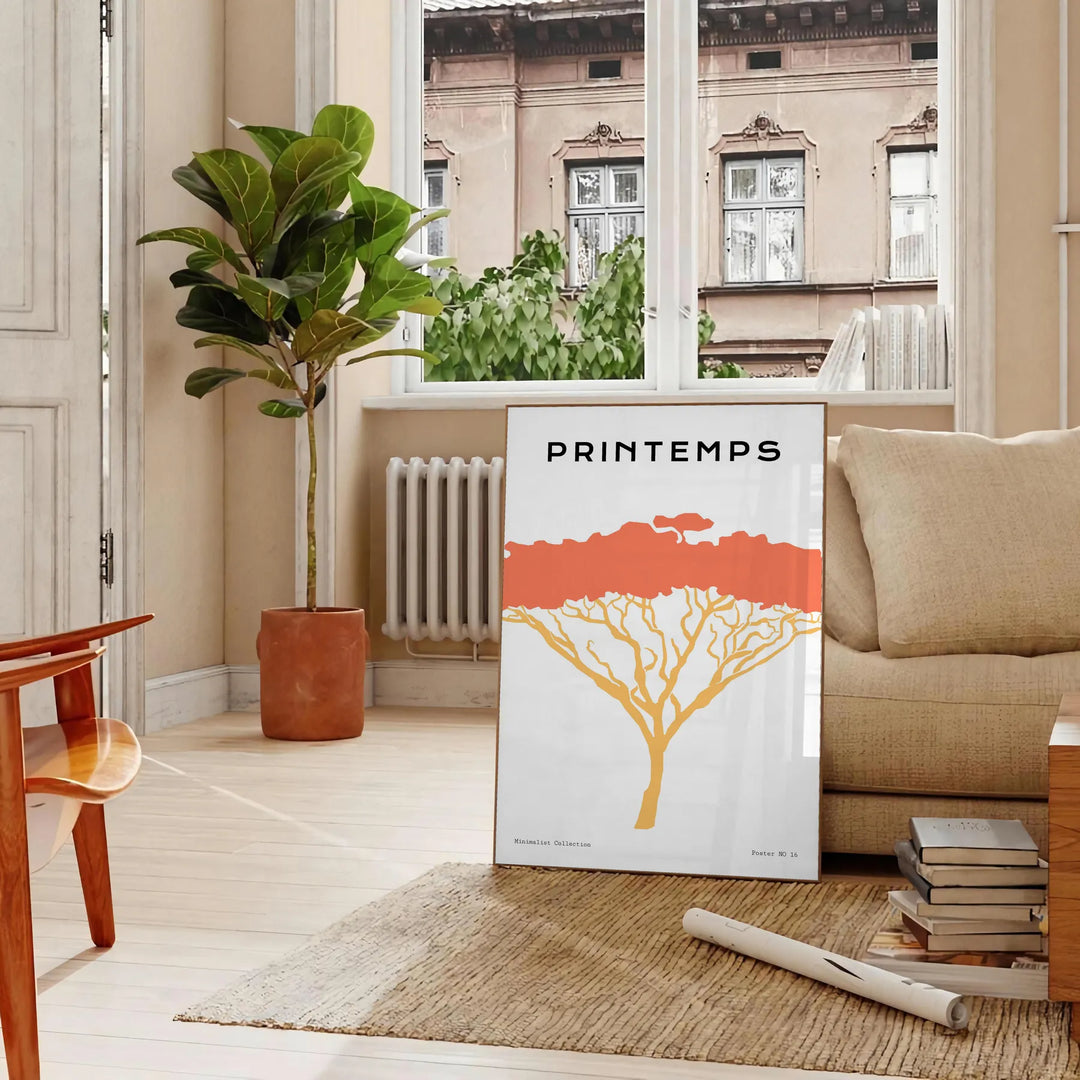 A stylized tree with various animal silhouettes in black and orange hues - in a Parisian living room with a sofa and a fig plant