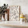 A modern poster featuring a sleek design in gray and black tones - styled on a counter with eucalyptus and a bowl of lemons