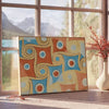 Abstract space design with gray and orange tones - beside a round wooden side table with books